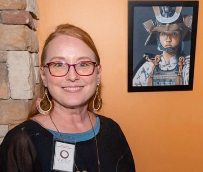 Artist Angeline Collier with one of her paintings.